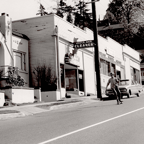 portland street with local teen riding skateboards